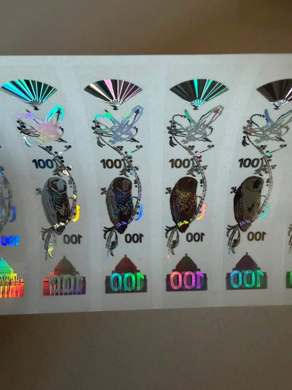 Holographic $100 prop note