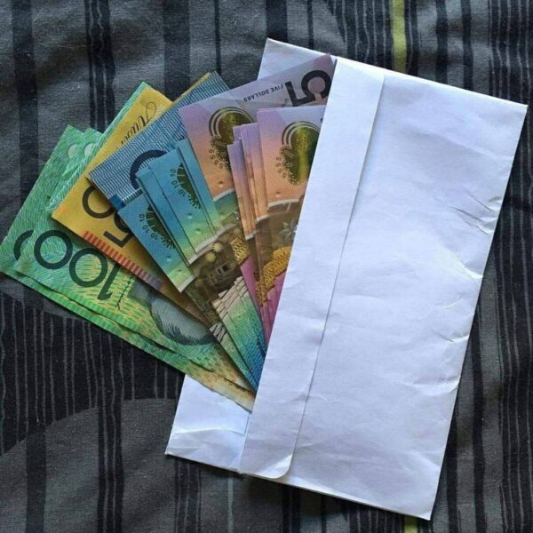 Mixed Australian prop note denominations with envelope